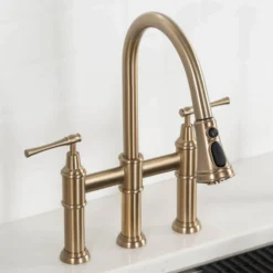 Transitional Bridge Kitchen Faucet with Pull-Down Sprayhead in Brushed Gold