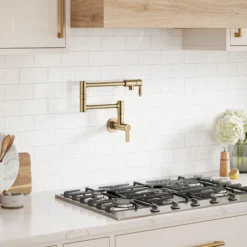 Wall Mount Pot Filler Kitchen Faucet with Retractable Arm in Spot-Free Brushed Brass
